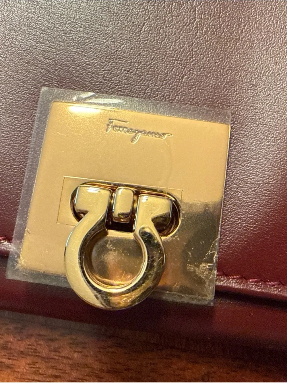 Salvatore Ferragamo Burgundy Leather Wallet with Gold Hardware
